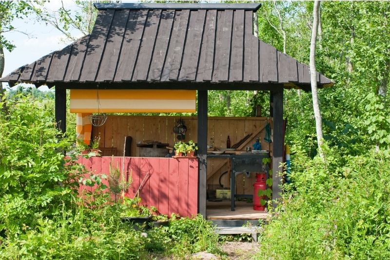 A roofed outdoor kitchen