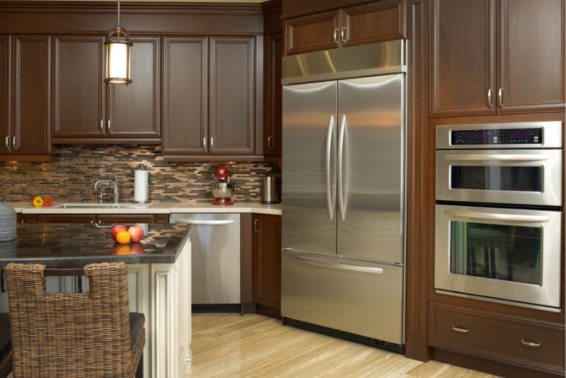 A luxurious kitchen fitted with high quality appliances and cabinets