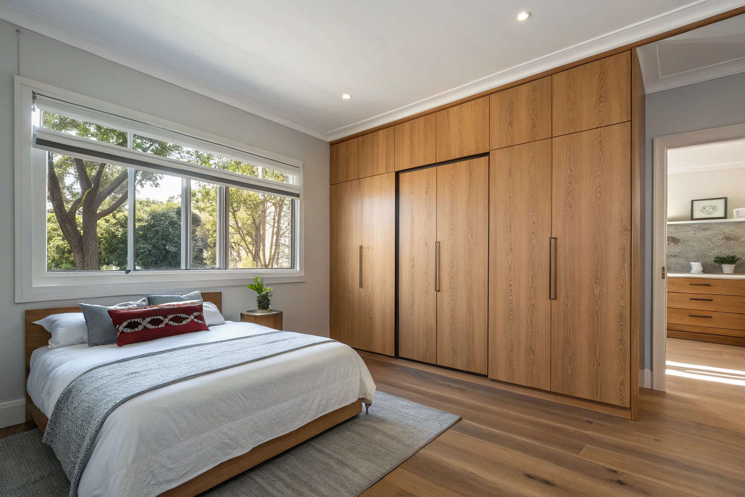 Custom built-in wardrobe with timber veneer doors